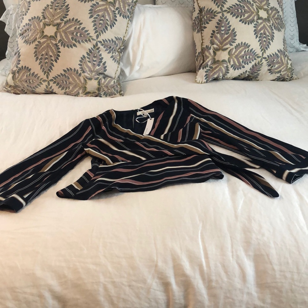 Never worn wrap blouse, Adelynrae size small
